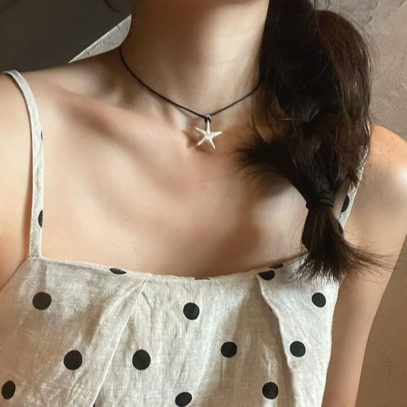 Original S990 Silver Starfish Necklace – Handmade Sandblasted Matte Finish with Black Cord — A minimalist starfish pendant in hand-sandblasted S990 silver, phot